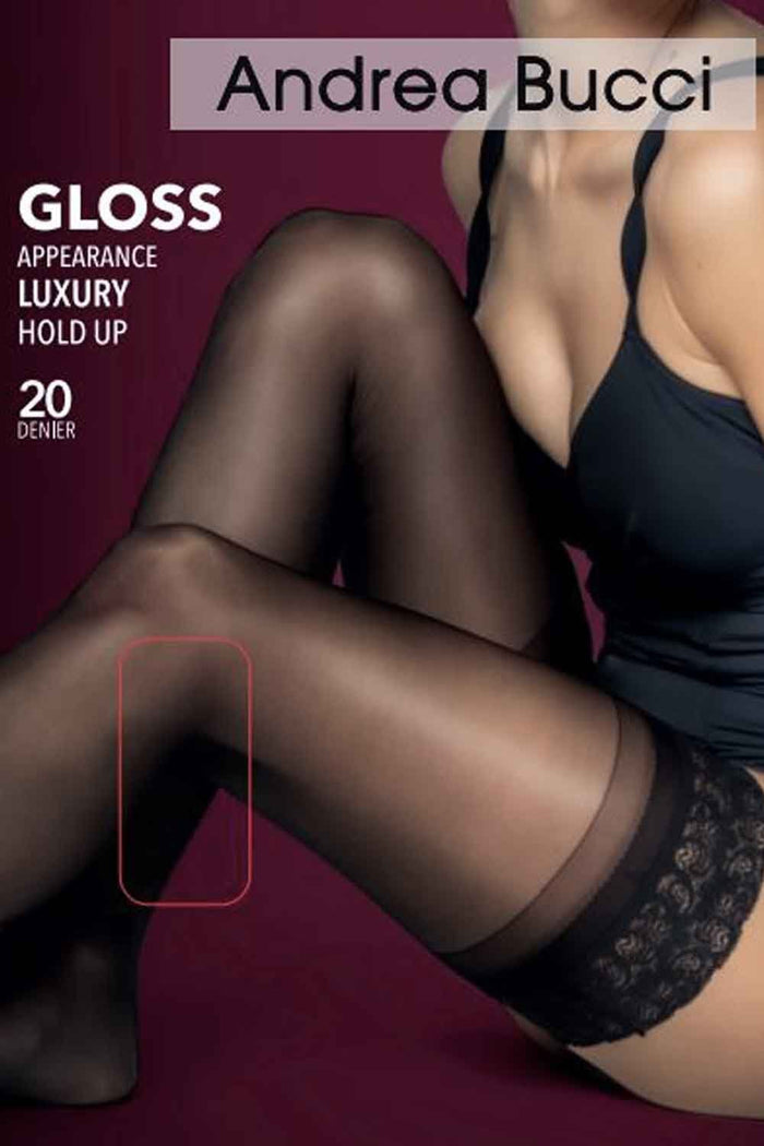 Person wearing black hold ups with Andrea Bucci branding on a maroon background