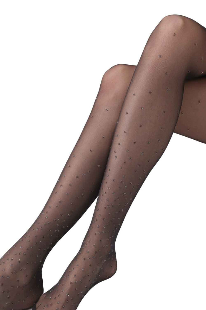Bright dot sparkly patterned tights on a white background