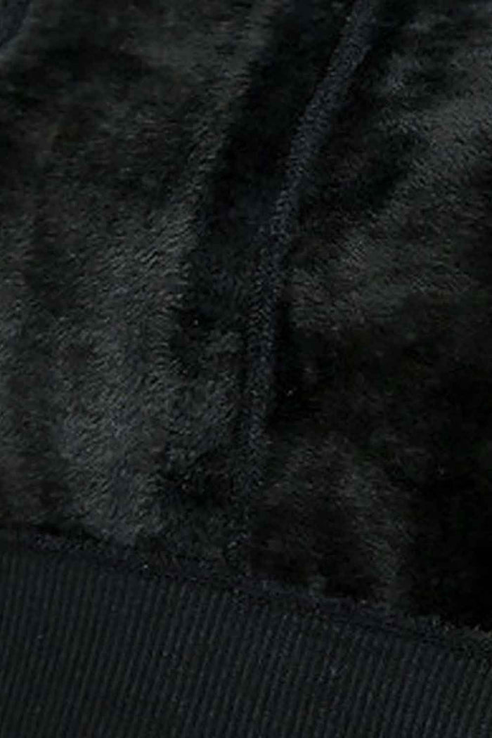 Close-up of dark fleece lined fabric texture of inside the footless tights