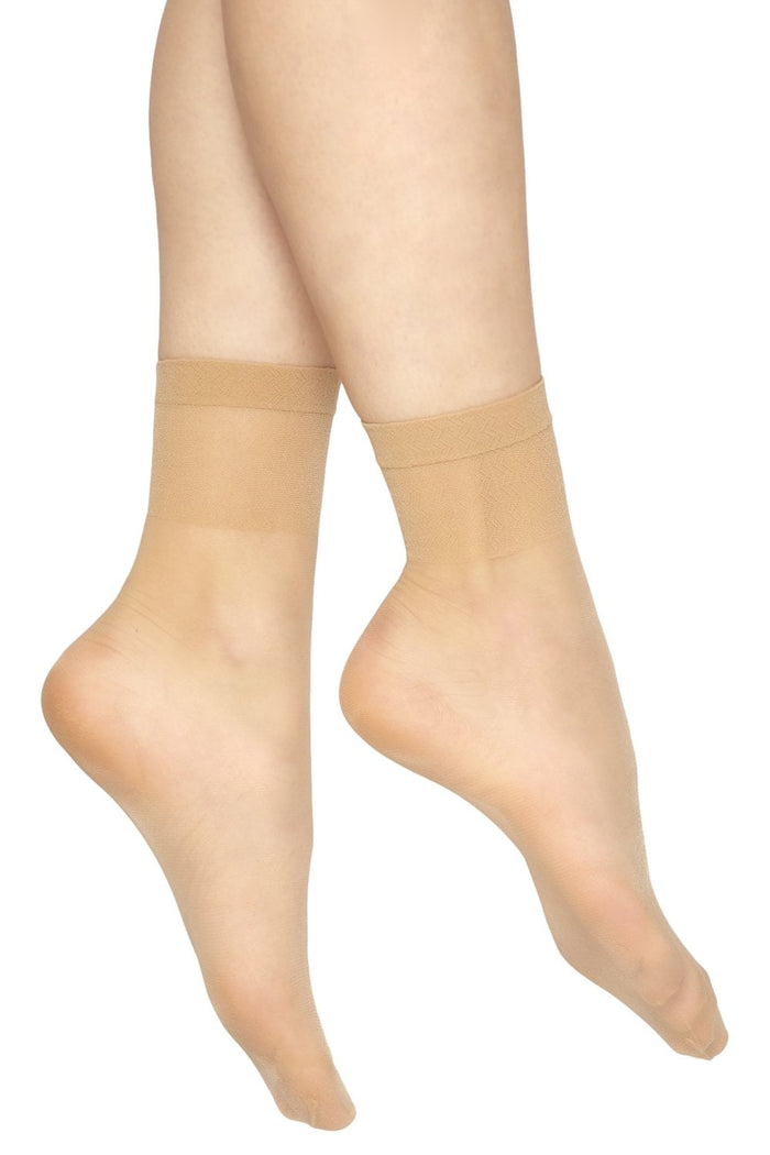 Natural toe ankle socks worn by a person on a white background