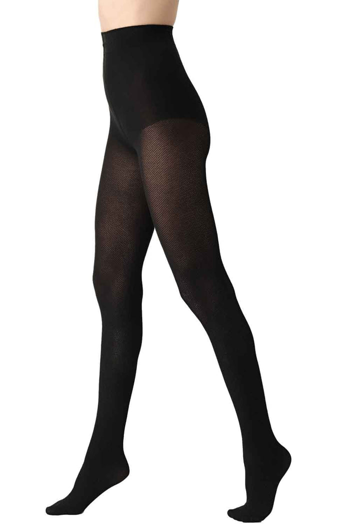 Black piquet opaque tights worn by a person on a white background