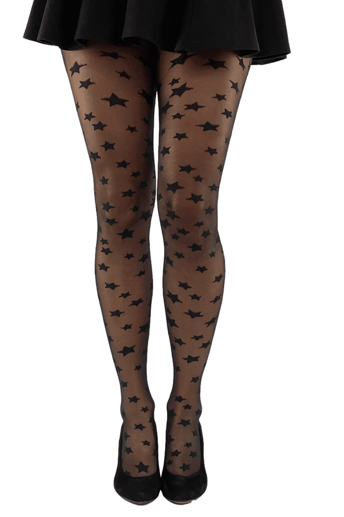 Black tights with star pattern worn by a model on a white background