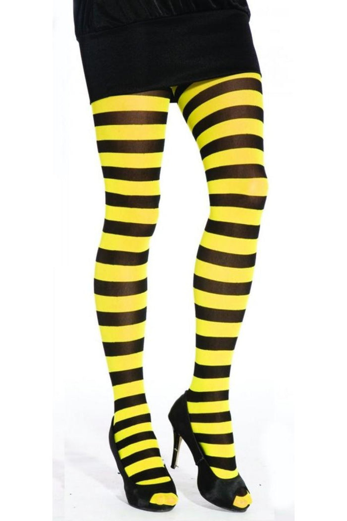 Black and yellow striped tights worn with black high-heeled shoes on a white background