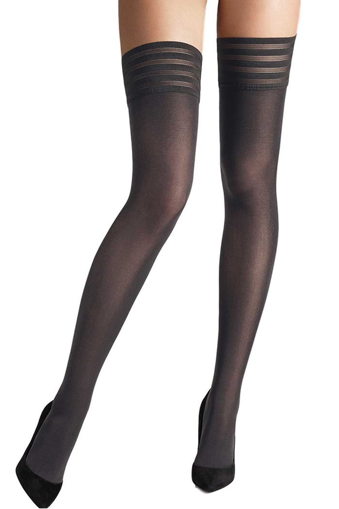 Black striped pattern top on plain black hold ups on a white background