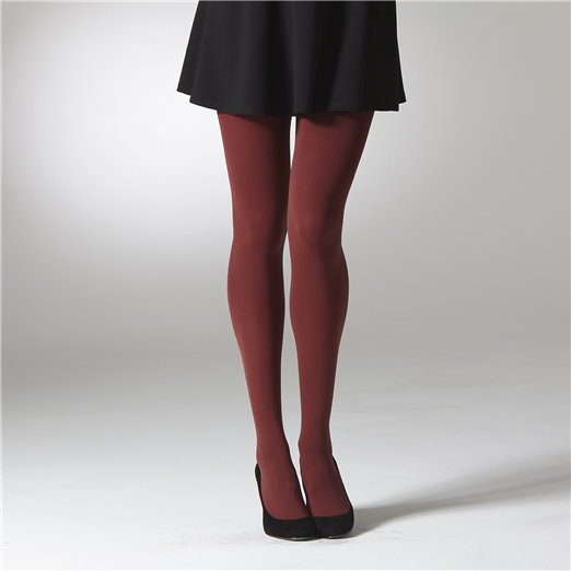dark red tights worn with a black skirt and shoes on a white background
