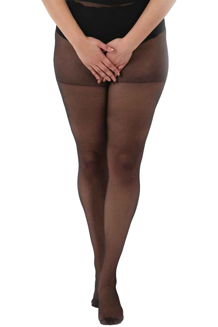 Black sheer crotchless tights worn by a person on a white background