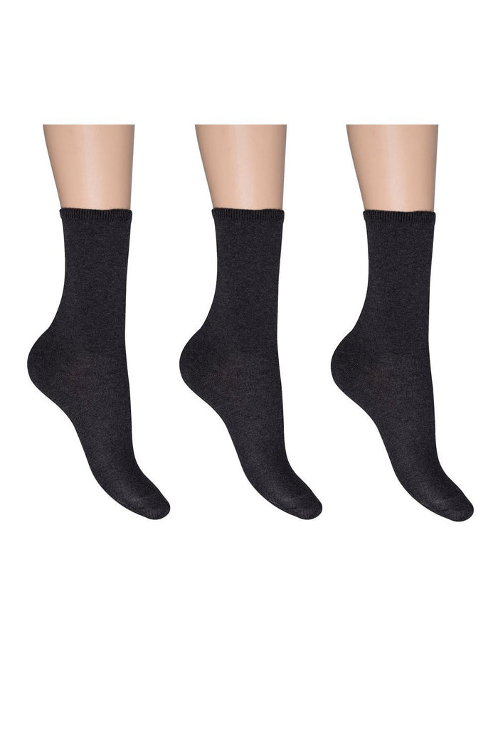 Navy socks worn on a white background