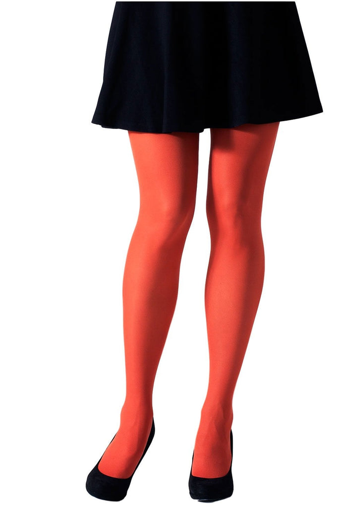Person wearing bright orange gipsy tights and a black skirt on a white background