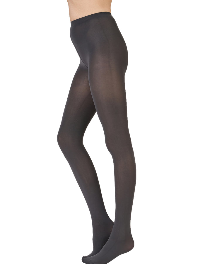 Charcoal tights worn by a person on a white background