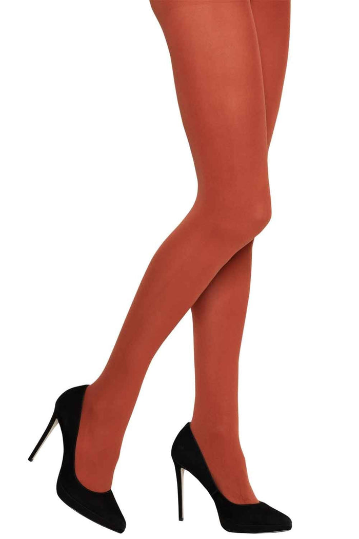 Charnos orange tights worn by a person with black high-heeled shoes on a white background