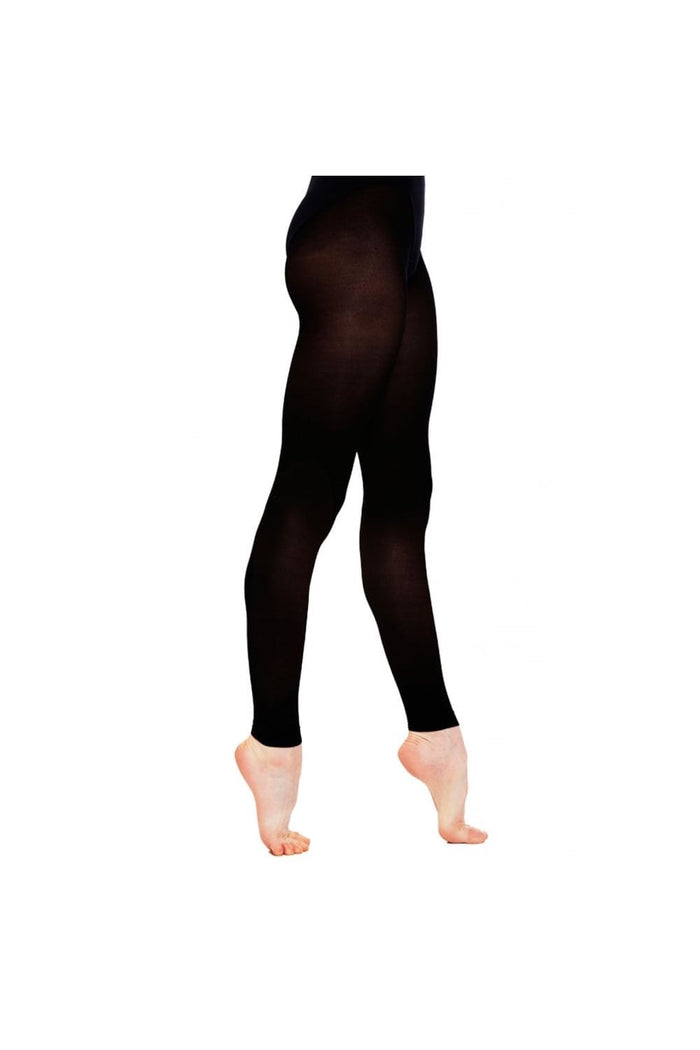 Black footless dance tights worn by a person on a white background
