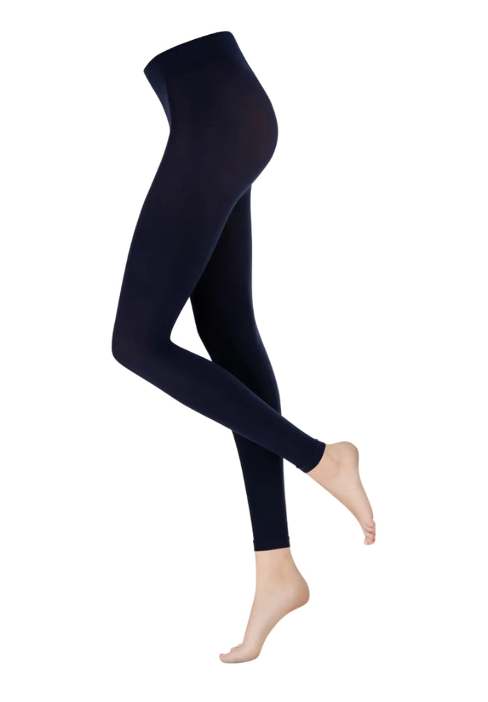 Navy blue leggings worn by a person on a white background