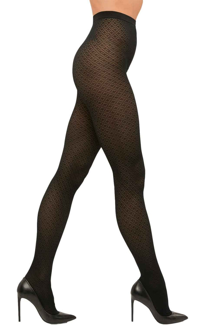 Black patterned  tights worn by a model on a white background