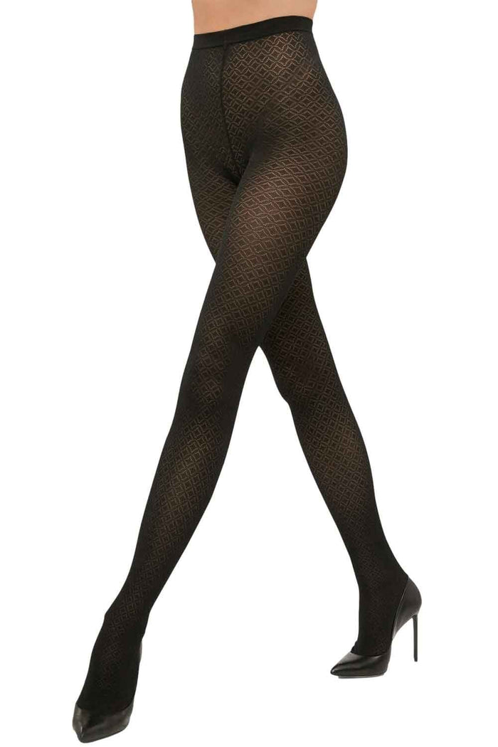 Black jacquard patterned  tights worn by a model on a white background