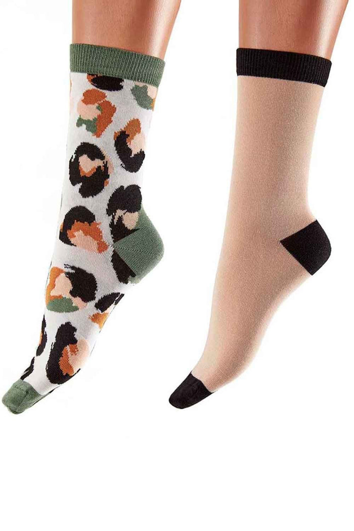 Colorful sock with animal pattern and plain sock with black toe, heel cuff worn by a person on a white background