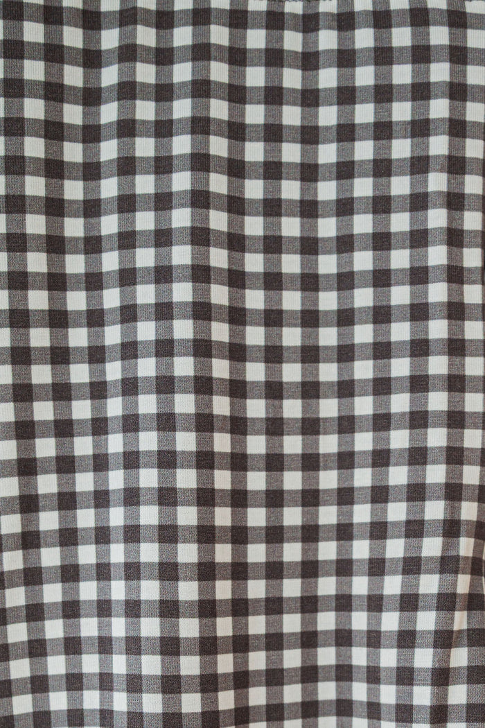 Close-up of the green gingham pattern on forever french baby’s Bamboo Two Piece Pajamas—featuring breathable, evenly spaced squares perfect for children's sleepwear.