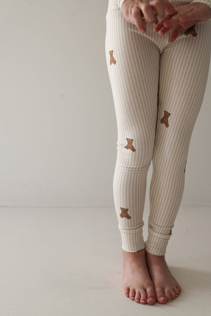 A person wearing forever french baby Bamboo Two Piece Pajamas in the Teddy design.