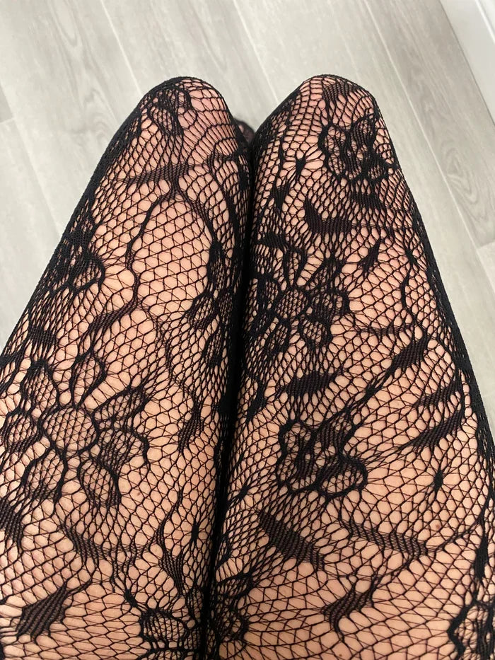 Black tights with lace design by Allana, on a beige background