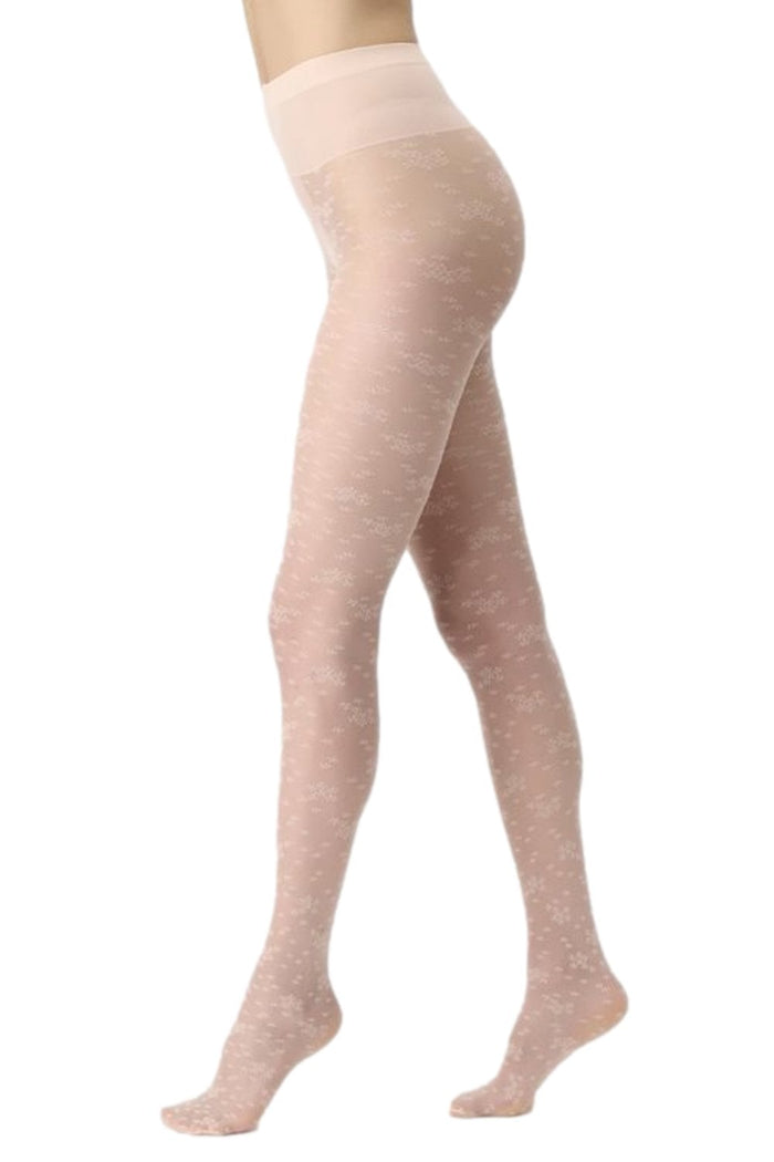Light coloured blossom patterned tights worn by a person on a white background