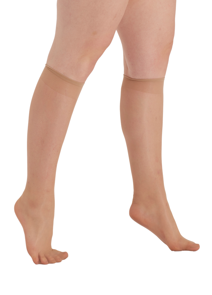 Nude knee high socks  worn by a person on a white background