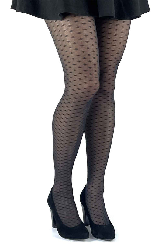 Black lace effect  tights worn with a black skirt and shoes on a white background