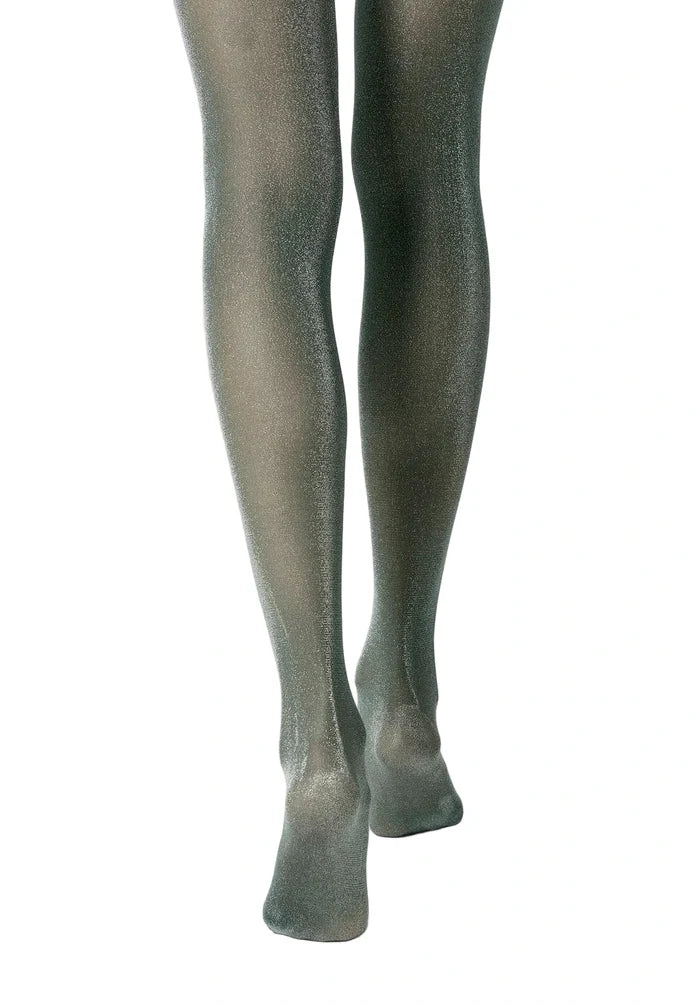 Green sparkly tights worn by a person on a white background