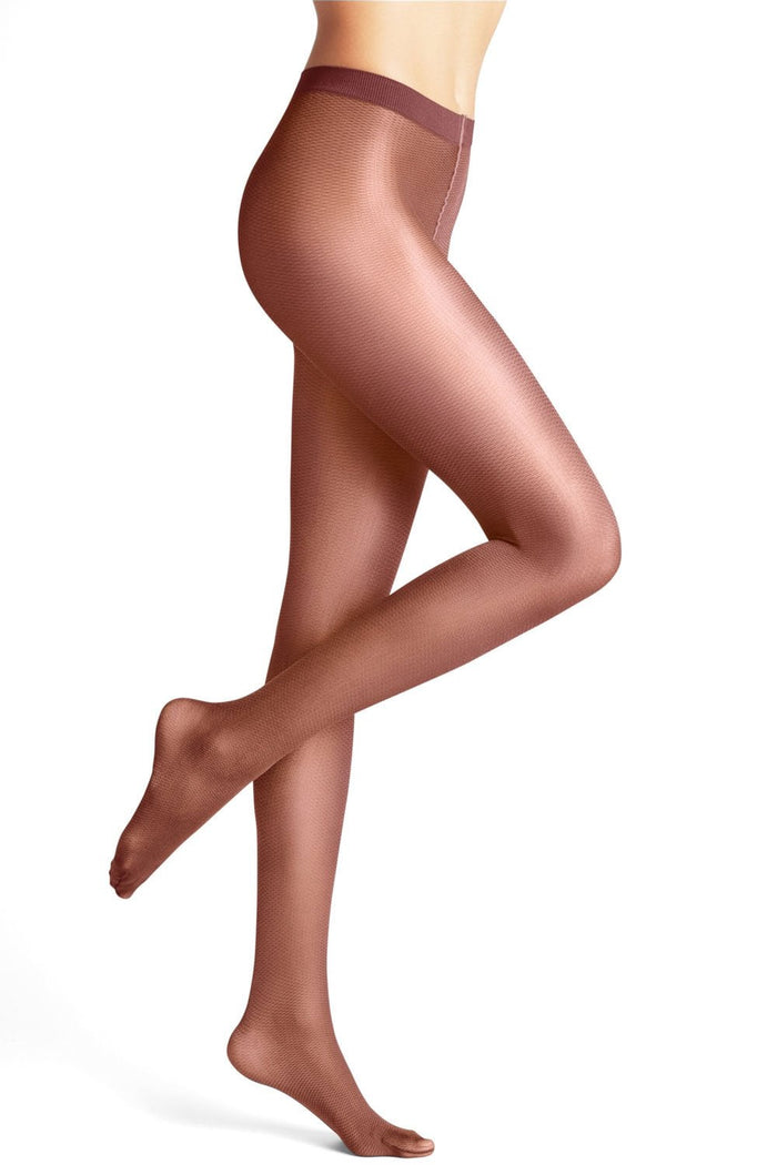 Rust coloured tights worn by a model on a white background