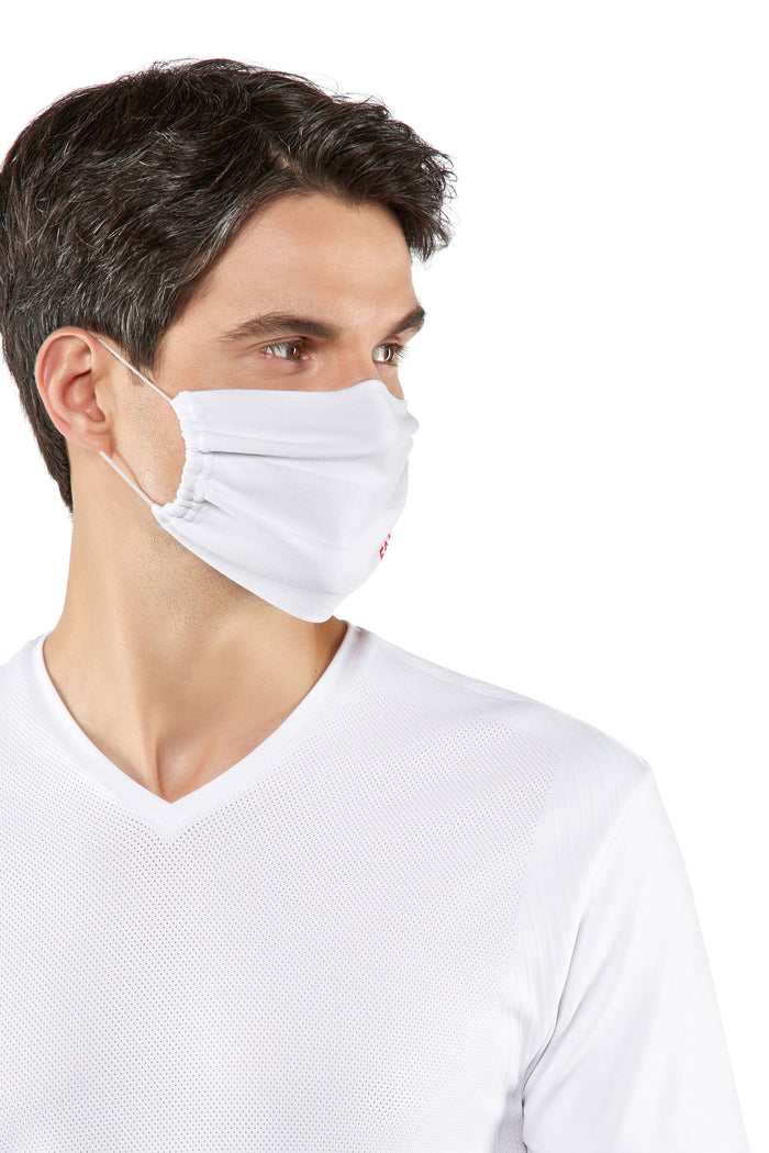 Man wearing a white Falke face mask on a white background
