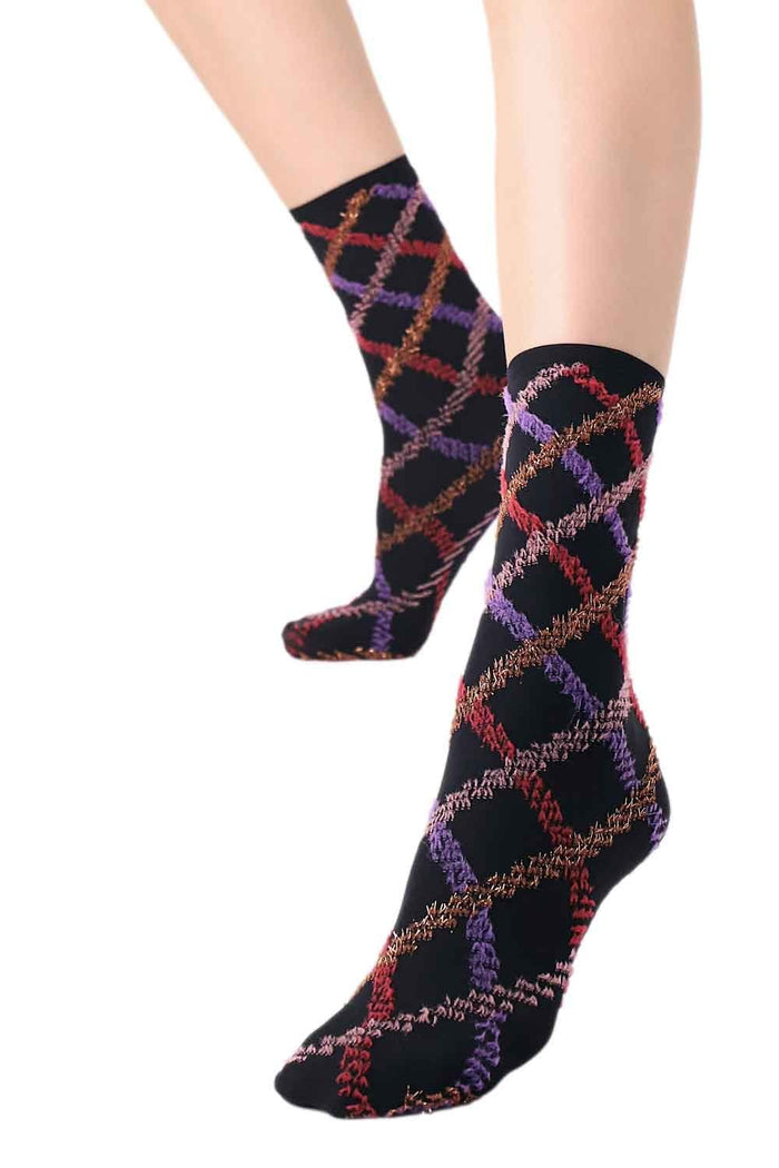 Colorful patterned tartan socks on a white background