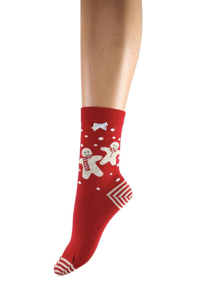 Red Christmas-themed socks with gingerbread men and snowflakes on a white background