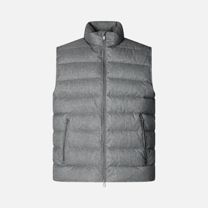Gray puffer vest on a beige background