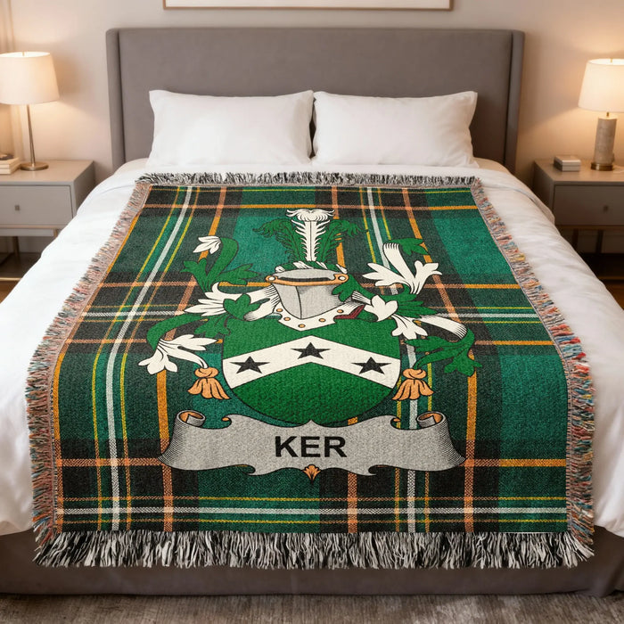 Ker Irish family crest woven blanket displayed on a bed.
