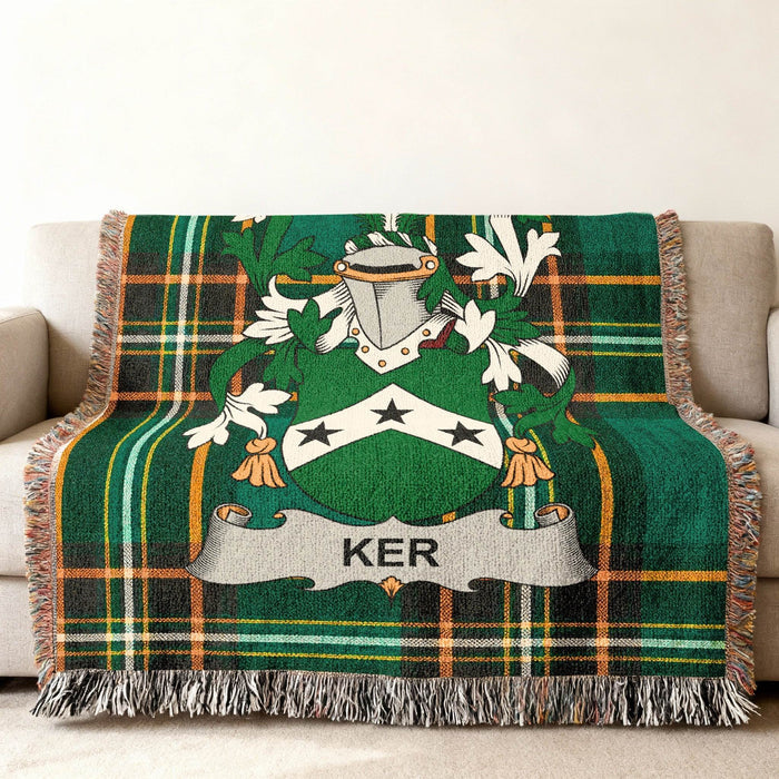 Ker family crest on an Irish National Tartan woven cotton throw.