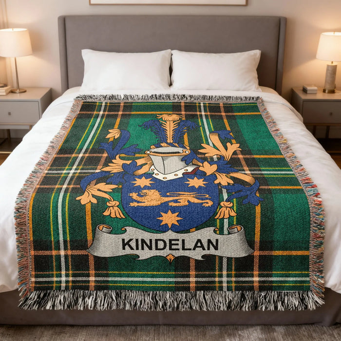 Kindelan Irish family crest woven blanket displayed on a bed.
