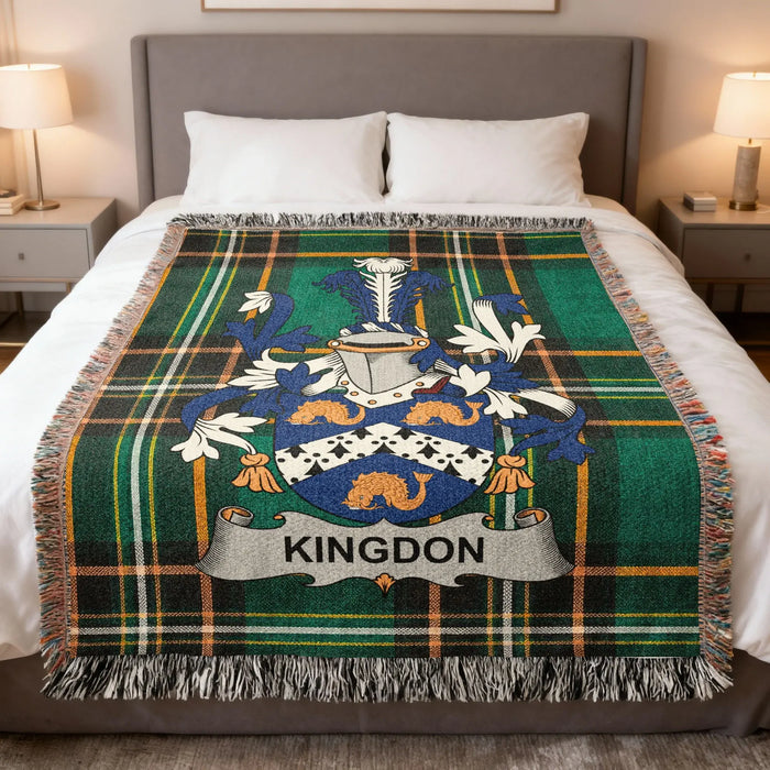 Kingdon Irish family crest woven blanket displayed on a bed.
