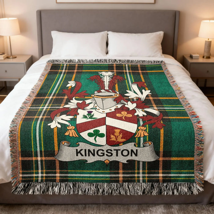 Kingston Irish family crest woven blanket displayed on a bed.