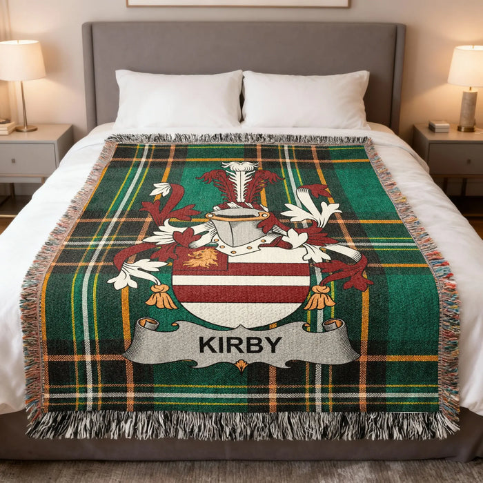 Kirby Irish family crest woven blanket displayed on a bed.
