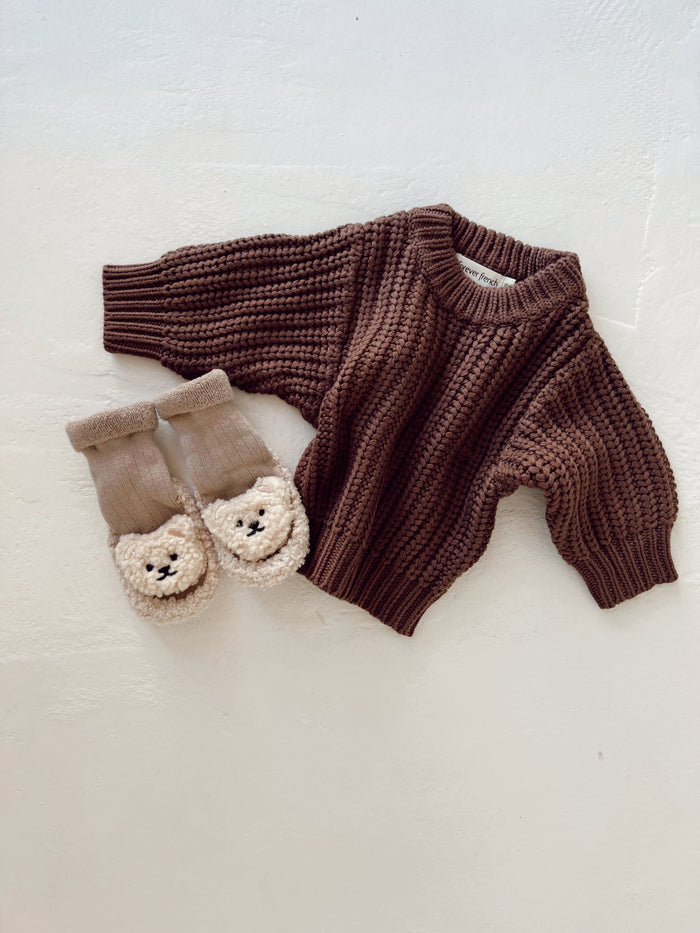 The Hot Cocoa | Knit Sweater by forever french baby is displayed beside beige baby socks with bear faces, all set on a white background—a cozy sweater set perfect for little ones.