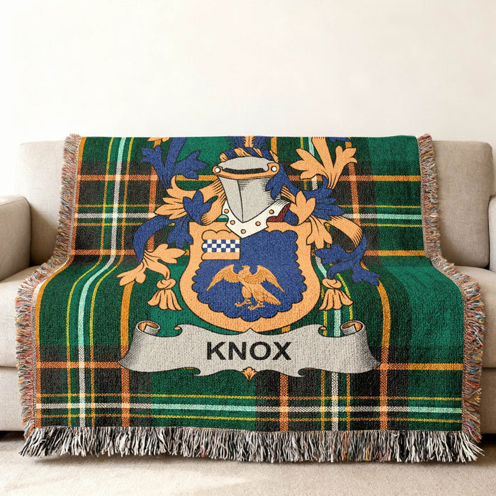 Knox family crest on an Irish National Tartan woven cotton throw.