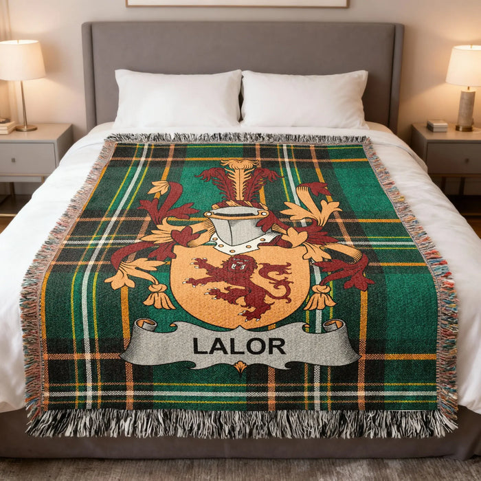 Lalor Irish family crest woven blanket displayed on a bed.