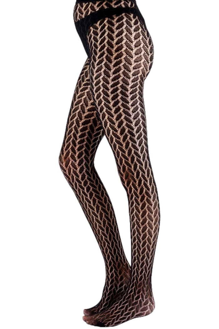 Leaf patterned tights worn by a person on a white background