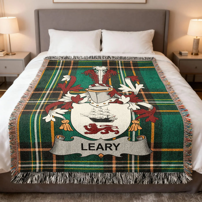 Leary Irish family crest woven blanket displayed on a bed.