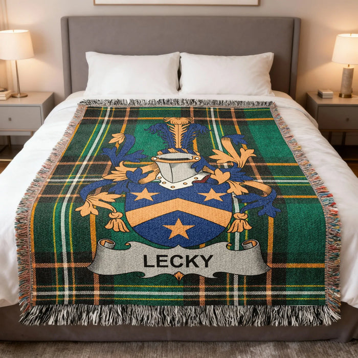 Lecky family crest woven blanket displayed across a made bed.