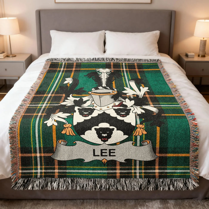 Lee family crest woven blanket set out across a bed.