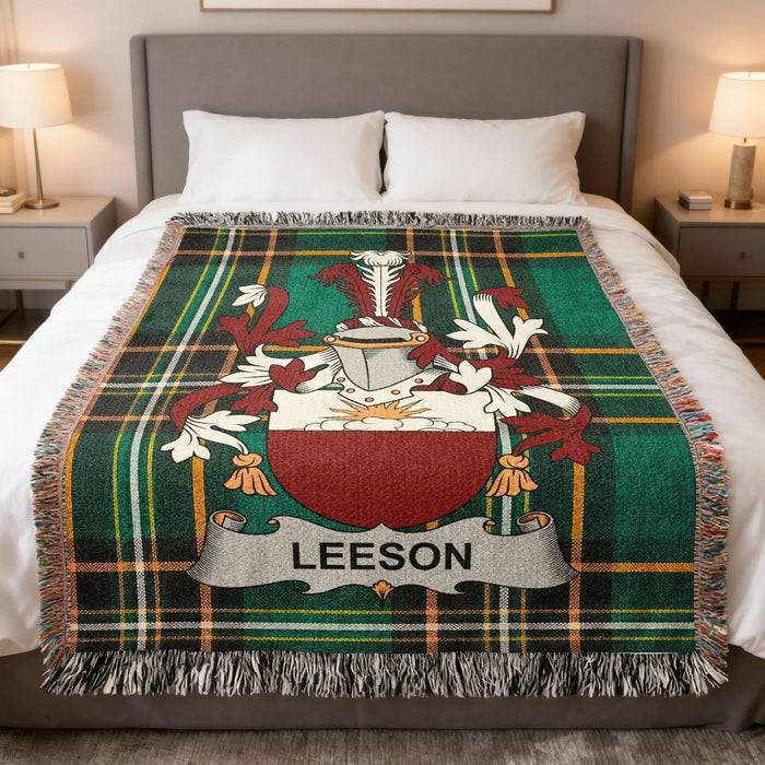 Leeson Irish family crest woven blanket displayed on a bed.