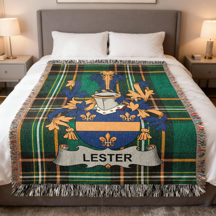 Lester family crest woven blanket displayed on a made bed.