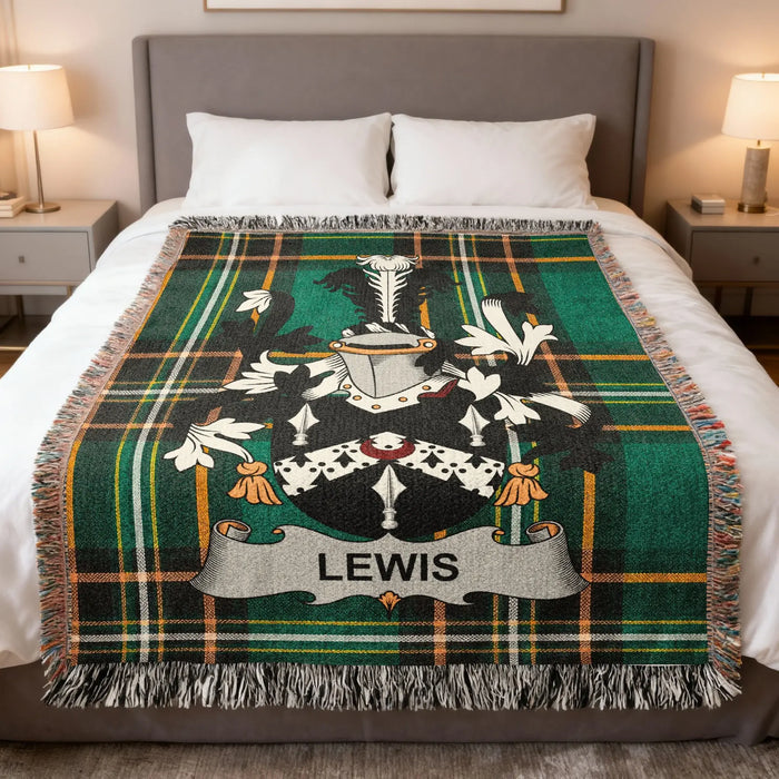 Lewis family crest woven blanket styled on a made bed.
