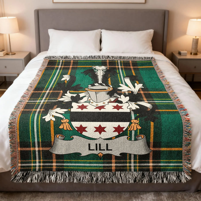 Lill family crest woven blanket set out across a bed.