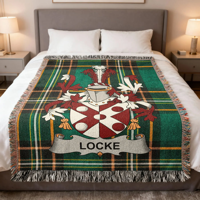 Locke family crest Irish National Tartan woven blanket displayed on a bed.