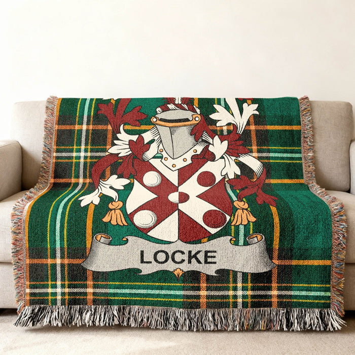 Close view of the Locke family crest woven into Irish National Tartan cotton fabric.